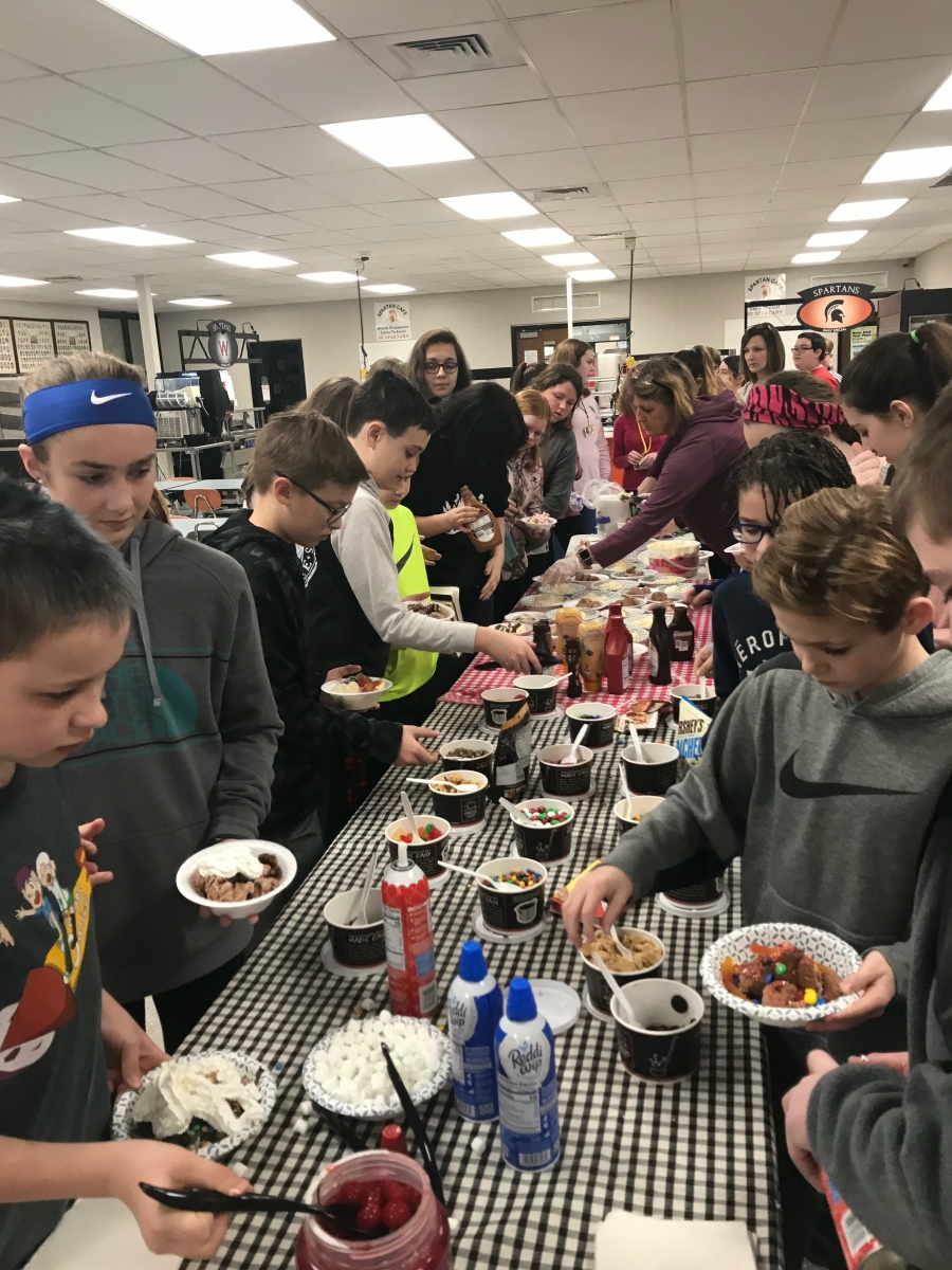 students standing around a table